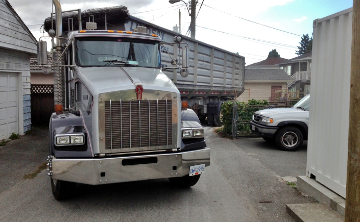 truck maneuvering in tight urban space